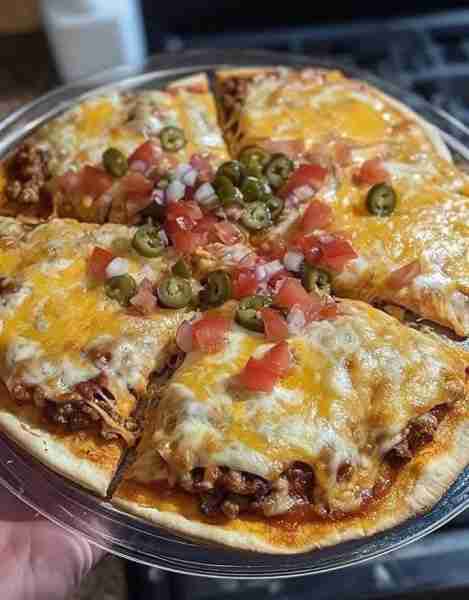 Homemade Mexican Pizza Ingredients: - 1 pound lean ground beef - 1 packet (1 ounce) taco seasoning...