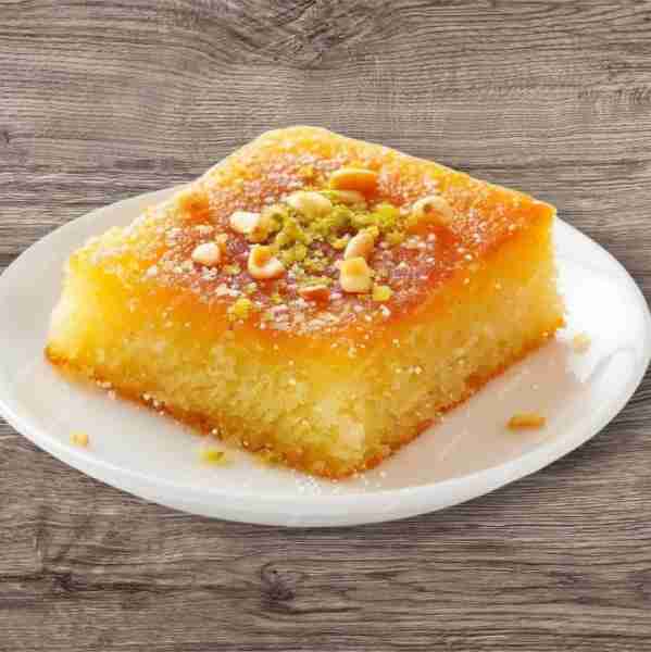 Revani is a moist and airy Greek semolina cake, delicately soaked in citrus-infused syrup. Flavored...