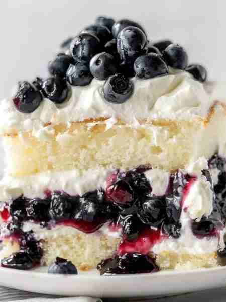 This dreamy Blueberry 🫐 Shortcake Cake has the most tender cake crumb, a beautiful stabilized whipp...