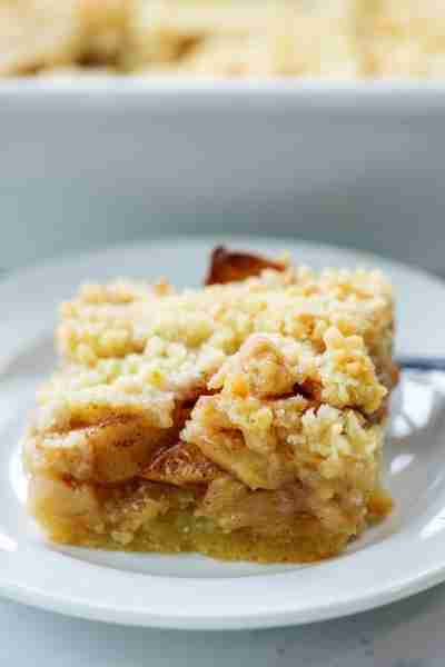 Recipe: https://www.bunsinmyoven.com/apple-pie-bars/ Apple Pie Bars with a drizzle of caramel and a...