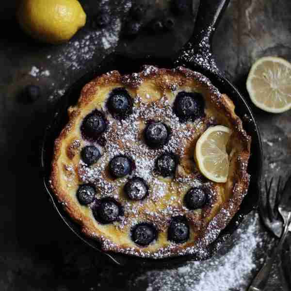 🎉 Blueberry Lemon Dutch Baby Delight 🍋 There's nothing like a fluffy Dutch Baby with a burst of bl...