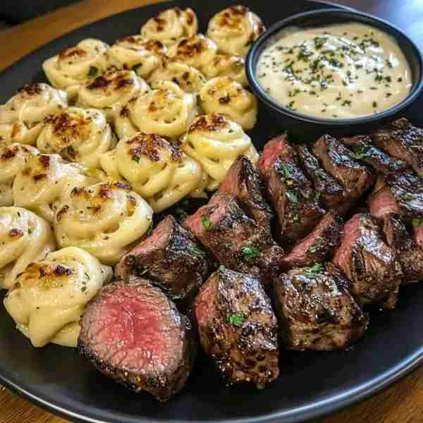Garlic Butter Steak Bites & Rich Alfredo Twisted Pasta **Ingredients:** **For the Steak Bites:** -...