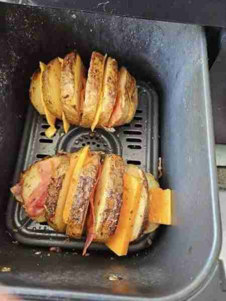 I am totally addicted. Baking potatoes. 10 mins in microwave. Sliced. Brushed with a mixture of melt...
