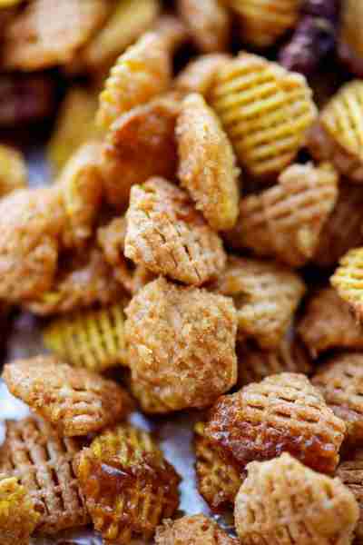 The ultimate Praline Crunch Snack Mix – Crispix cereal and pecans coated in a buttery brown sugar sa...