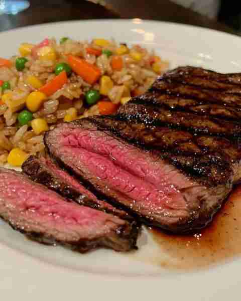 Sliced Grilled Steak with Vegetable Stir-Fried Rice Ingredients: For the Steak: 1–2 ribeye or strip...