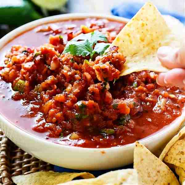 Fire-Roasted Salsa is a restaurant-style salsa that only takes minutes to make in the blender and re...