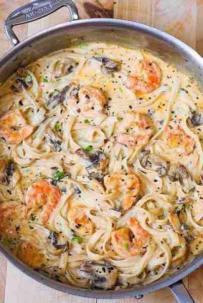Creamy Shrimp Pasta with Mushrooms in a homemade alfredo sauce. With Parmesan and Mozzarella cheese,...