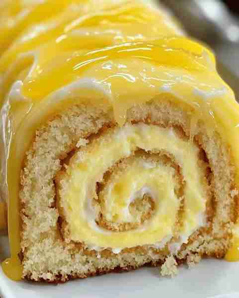 Zesty Lemon Cream Cheese Delight Roll Recipe: Ingredients: 4 large eggs, separated 1 cup granulated...