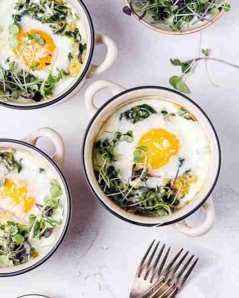 Parmesan Baked Eggs & Creamy Spinach are soooo tasty thanks to the freshly grated parmesan cheese an...