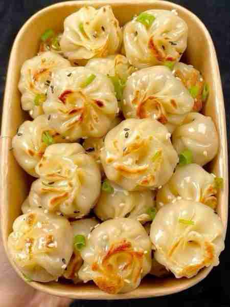 Pan-Fried Dumplings (commonly known as Guo Tie in Chinese). These dumplings are typically filled wit...