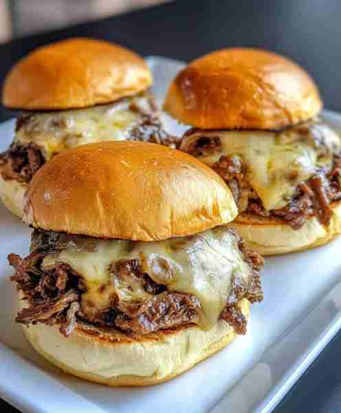 These homemade Philly cheesesteak sliders are a real crowd-pleaser. Baked on sweet rolls with tender...