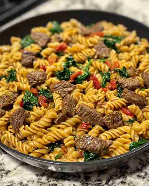 Creamy Garlic Parmesan Beef with Spinach Rotini Ingredients: 1 pound beef sirloin, thinly sliced aga...