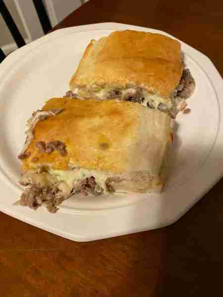Cheesesteak Stromboli’s 1 box of steak ums made on skillet with sliced onion, I add steak seasoning....