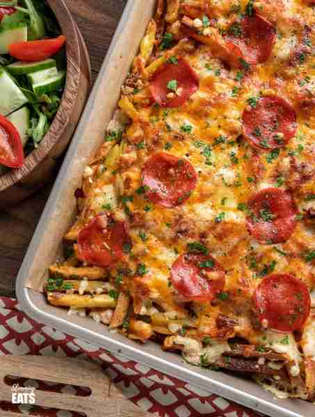 Cheesy Oven-Baked Pizza Fries – the ultimate sharing traybake for all the pizza lovers out there. Ho...
