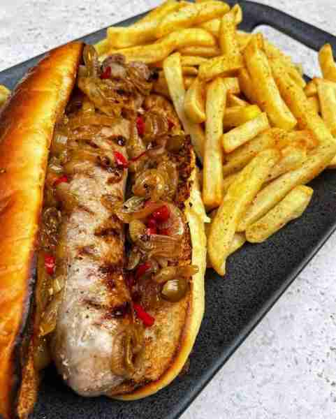 Grilled Sausage Sandwich with Onions & Fries Ingredients: 1 grilled sausage (bratwurst or Italian-st...