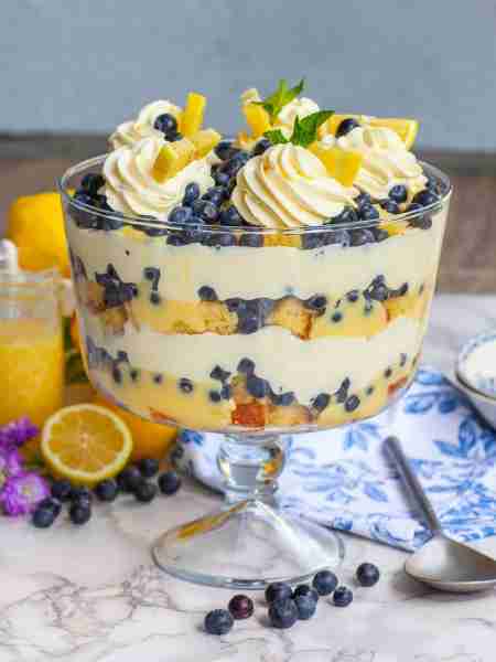 I love this trifle for Easter! Creamy Lemon Blueberry Trifle with lemon cake, lemon curd, loads of b...