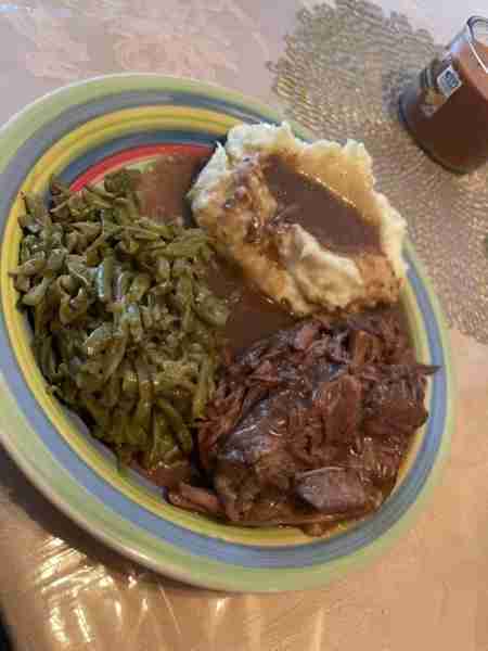 Homemade beef roast over bread with mashed potatoes and French style green beans ☺️