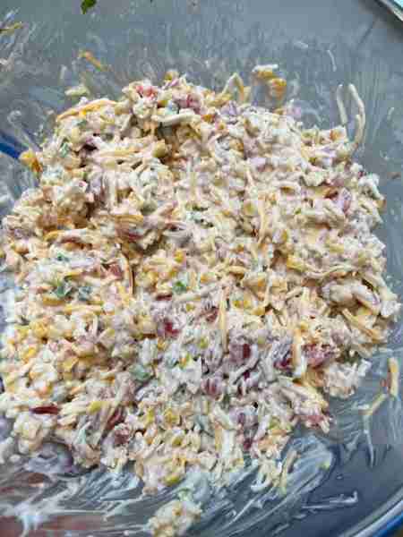 Southwest Corn Dip 1 can Rotel 1 can southwest corn Half cup Mayo Half cup sour cream 8 ounce shredd...
