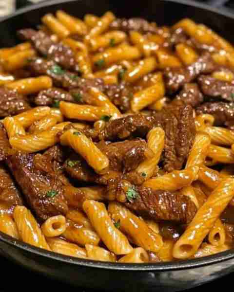 One-Pot Smoky Honey BBQ Steak Pasta Ingredients: 1 lb steak, sliced into strips 12 oz penne or rotin...