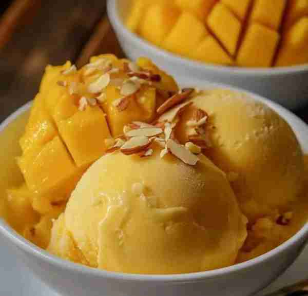 Mango Almond Ice Cream 🍦🥭 Ingredients: - 2 ripe mangoes, pureed - 1 cup almond milk - 1/2 cup heav...