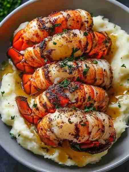 Butter-Seared Lobster Tails over Creamy Mashed Potatoes 🦞🥔 Decadent, buttery bliss in every elegan...