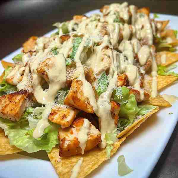Chicken Caesar Salad Nachos Ingredients: • Tortilla chips (homemade or store-bought) • 2 grilled chi...