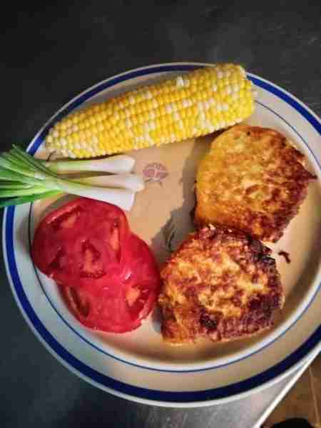 Veggie plate tater cakes corn onion tomato. Thanks for all the compliments I will tell the cook she...