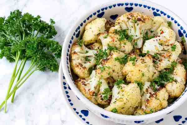 Roasted Cauliflower + Garlic Vinaigrette is my FAVORITE veggie side! Pair it with our Honey Lime Sal...