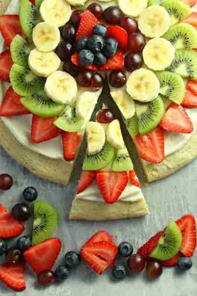Fruit Pizza on a Sugar Cookie Crust! 🍓🍌🥝 Delicious Fresh Fruit is Beautifully arranged on top of...