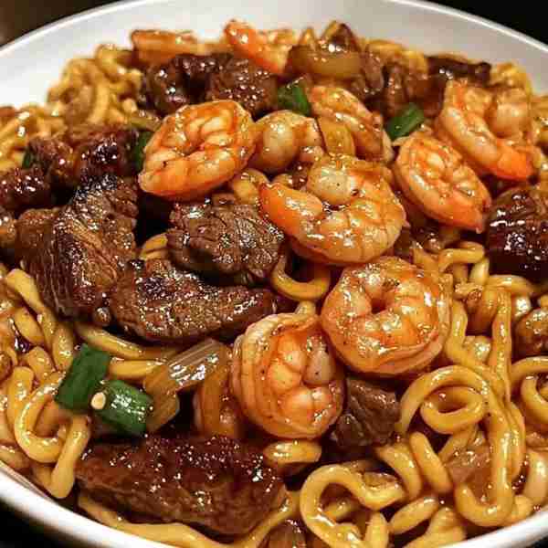 Garlic Butter Steak and Shrimp Stir-Fried Noodles Ingredients: 8 oz sirloin steak, thinly sliced 12...