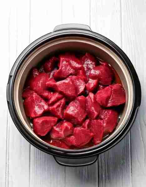 Put raw beef stew meat in a slow cooker with these 4 ingredients. The sauce is straight out of a Fre...
