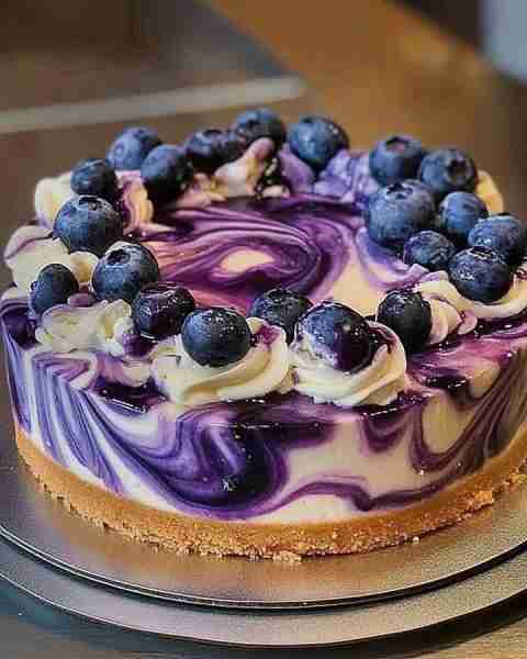 🫐🍰 Blueberry Swirl Cheesecake 🍰🫐 📝 Ingredients: For the crust: 1 1/2 cups graham cracker crumbs...