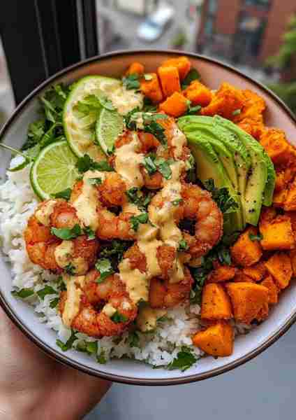 🌴 Coconut Garlic Shrimp & Sweet Potato Rice Bowl is a tropical-inspired dish that pairs tender, gar...