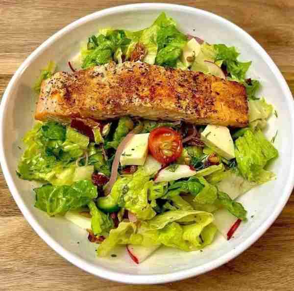 Delicious salad with salmon for dinner Salad: Romaine lettuce Tomato Cucumber Banana peppers Pickle...