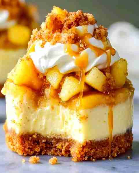MINI CARAMEL APPLE CHEESECAKE BITES Ingredients: For the Crust: 1 cup graham cracker crumbs 2 tbsp b...