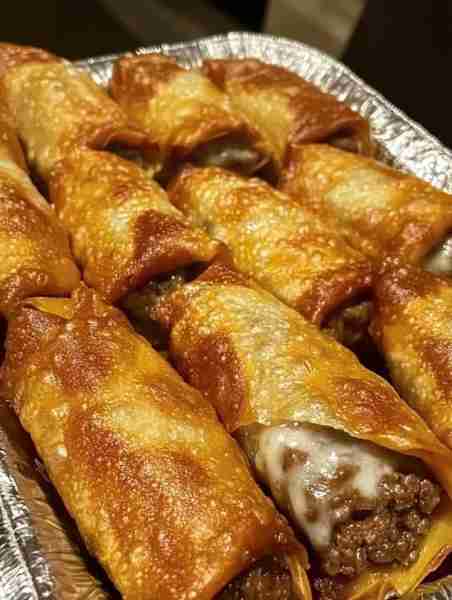 PHILLY CHEESESTEAK EGG ROLLS Ingredients: 1 large onion, chopped 1 large green bell pepper, chopped...