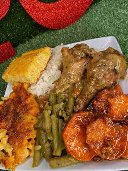 Made Smothered chicken, jasmine rice, candied yams, Mac and cheese, string beans and honey butter co...