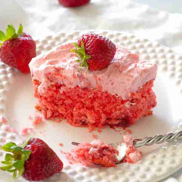 This strawberries and cream sheet cake is everything you want in a spring dessert—light, fluffy, and...