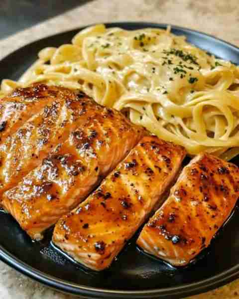 Cajun Honey Butter Salmon Bites Over Cheesy Creamy Linguine Ingredients: 4 salmon fillets, cut into...
