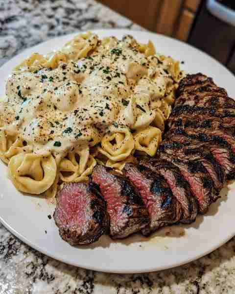 Cheesy Tortellini Alfredo with Grilled Steak Slices Ingredients: 1 lb cheese tortellini (fresh or fr...