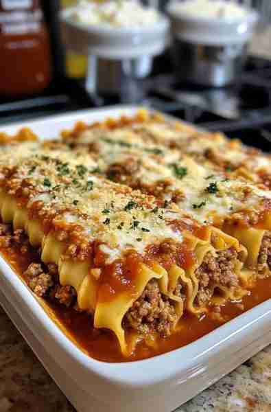 Baked Manicotti with Meat Sauce Ingredients: For the Meat Sauce: 1 lb ground beef (or ground turkey)...