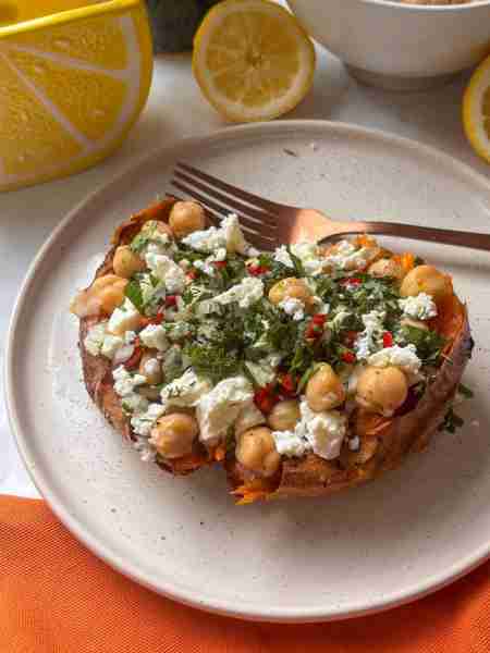 Stuffed Greek Sweet Potato! Roasted until caramelized and then stuffed with chickpeas, feta, fresh h...