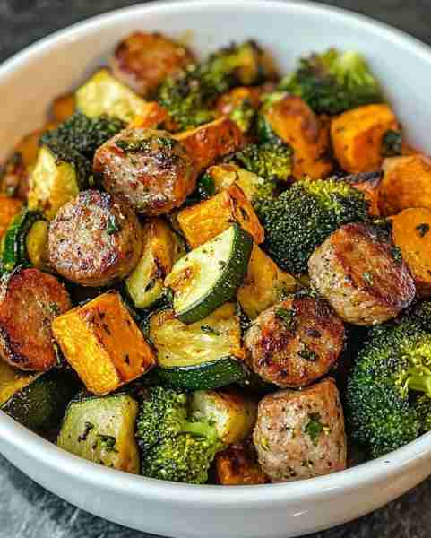 Roasted Sausages with Sweet Potato, Zucchini & Broccoli Ingredients: 4 Italian sausages (chicken), s...