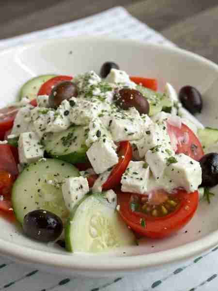 Greek Salad Ingredients: Cherry tomatoes, halved Cucumber, sliced Red onion, thinly sliced Kalamata...