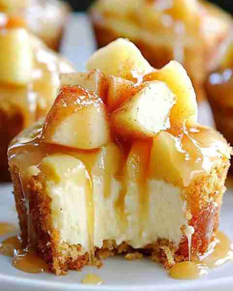 Irresistible Mini Caramel Apple Cheesecakes Ingredients: 1 cup graham cracker crumbs 2 tablespoons g...