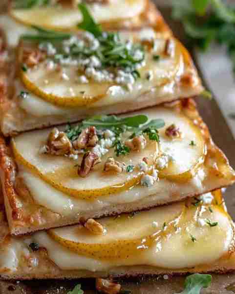 Pear and Gorgonzola Flatbread with Honeyed Walnuts and Arugula Ingredients: 1 sheet puff pastry or f...