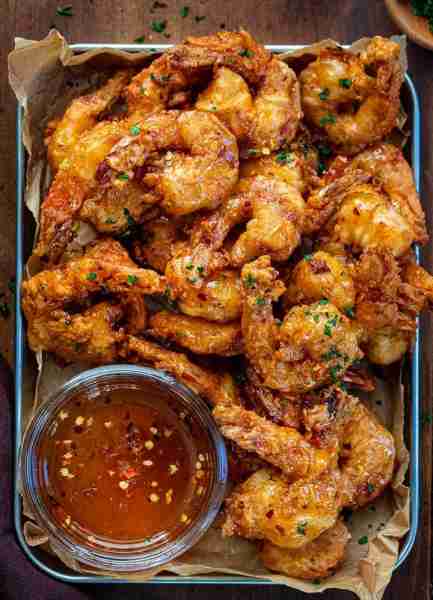 Crispy Shrimp with Sweet Chili Sauce Ingredients: For the Shrimp: 1 lb large shrimp, peeled and deve...
