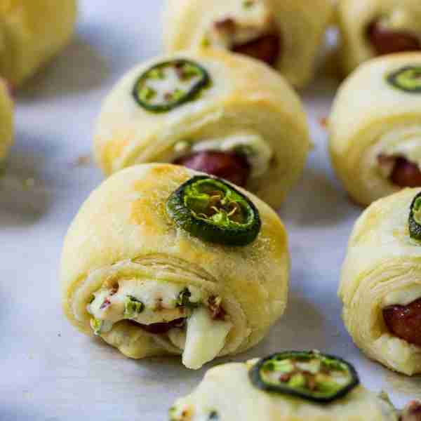Jalapeno Popper Pigs in a Blanket are a spicy, cheesy appetizer that will get gobbled up at parties...