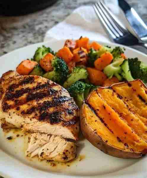 Grilled Chicken with Veggies & Sweet Potato Ingredients: 1 chicken breast 1 sweet potato, halved 1 c...