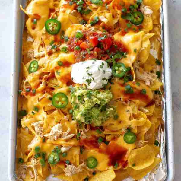 These sheet pan Chicken Nachos are loaded with cheese, salsa, and all your favorite toppings—perfect...